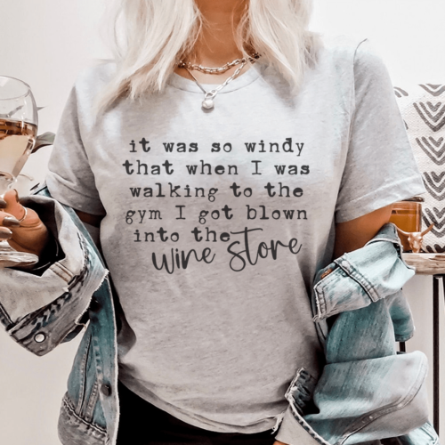 it-was-so-windy-that-when-i-was-walking-to-the-gym-i-got-blown-into-the-wine-store-tee