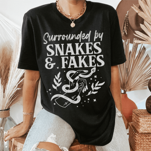 surrounded-by-snakes-fakes-tee